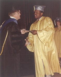 Rob Harleston receives his diploma from Professor Jim Null at 1983 UCCS Commencement ceremonies