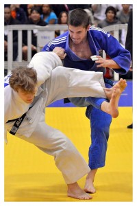 Austin Cook, in blue, will compete in a judo World Cup event in June.