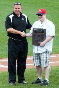 Sky Sox President and General Manager Tony Ensor, left, shakes hands with Trent Hale, the first recipient of the Sky Sox Sports Management Scholarship, at Security Service Field. Photo courtesy of Paat Kelly
