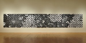 Jane Lackey, trans-location: call and response, paint, pen on black brocade cloth, 55 x 312 inches (26 feet), 2010.