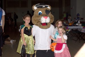 Clyde, the UCCS athletic mascot, poses with trick or treaters at a previous Boozar event.